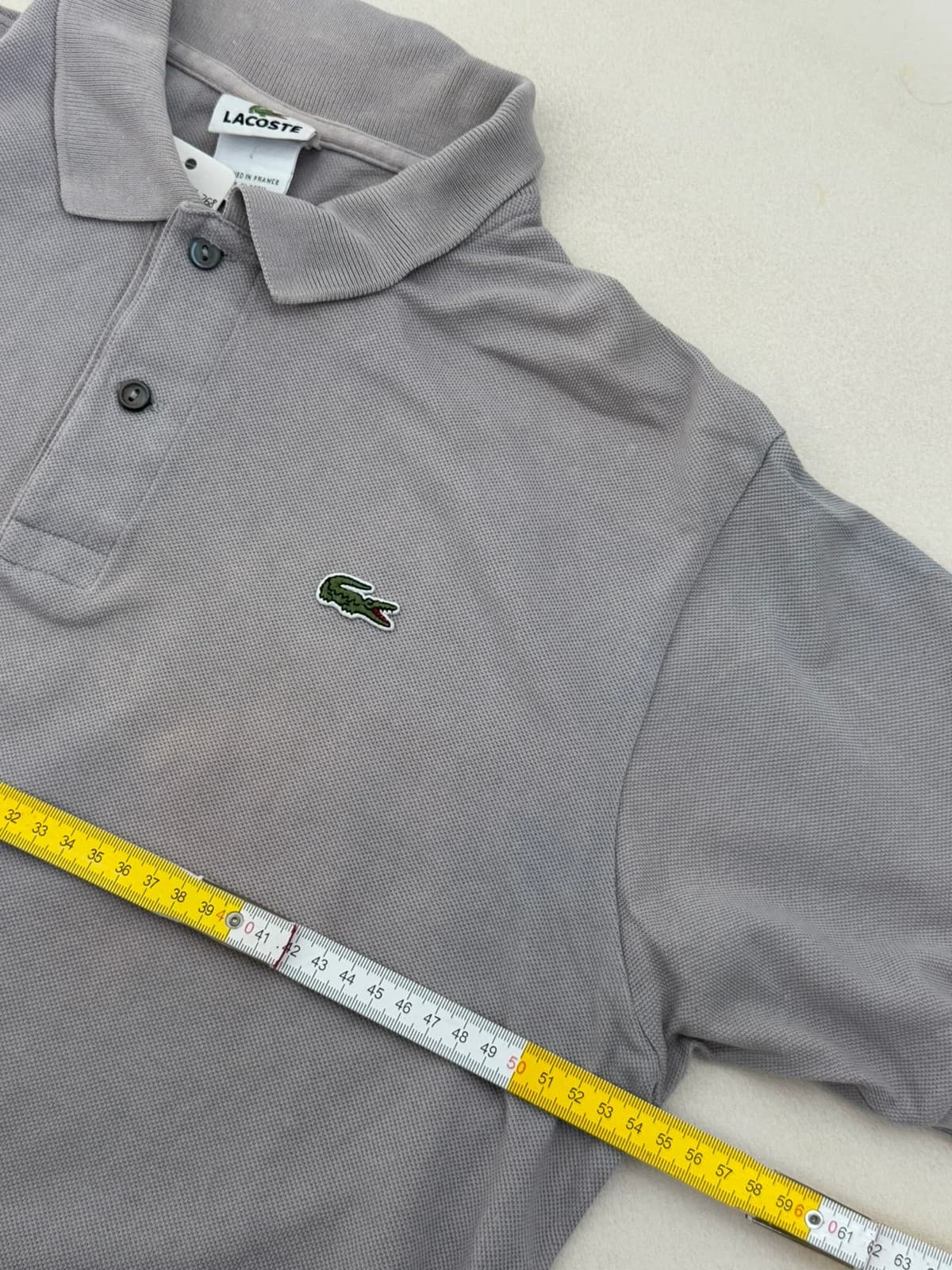 Polo piqué Lacoste gris clair taille 5/L - PP2603268 - Photo 8/9